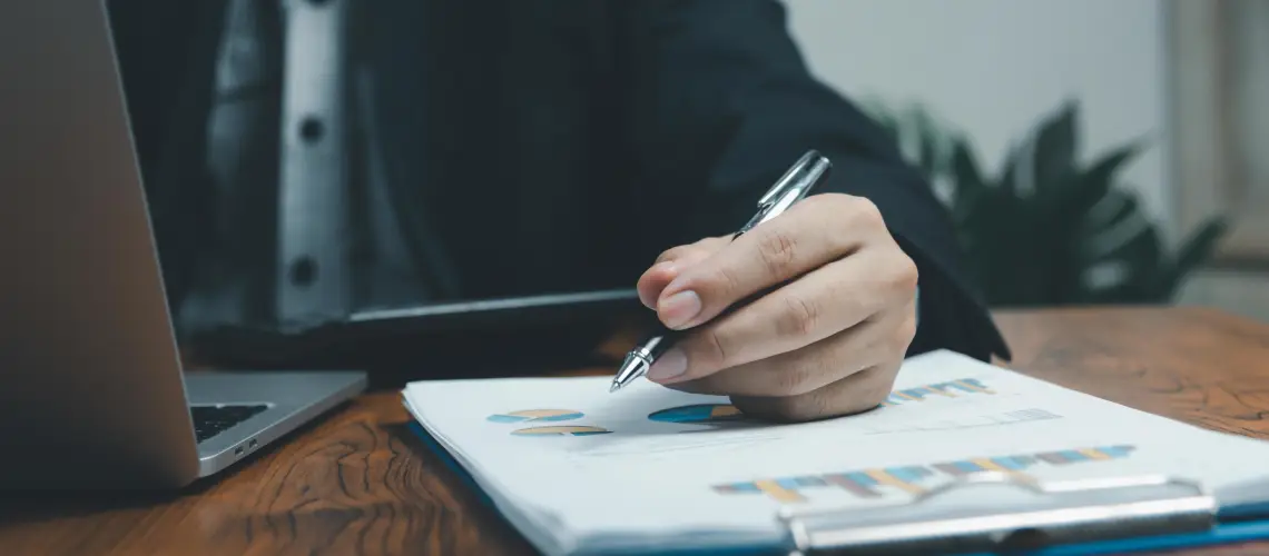 A business owner reviewing financial documents during a business valuation in Hobart