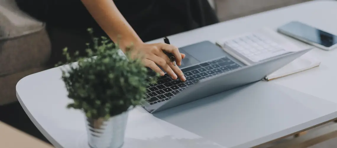 Homeowner using laptop for an online property valuation tool